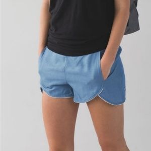 Lululemon blue chambray shorts size 4, lace detailing at edges, front pockets,